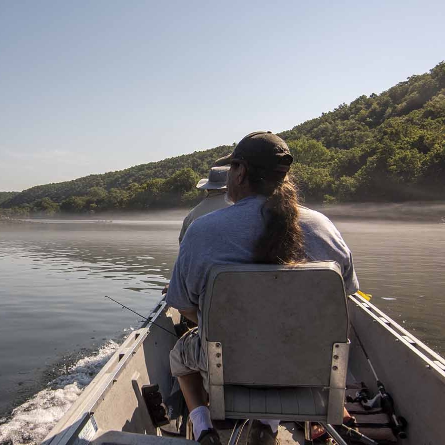 Anglers Drinking Coffee on the Porch of Cabin 8