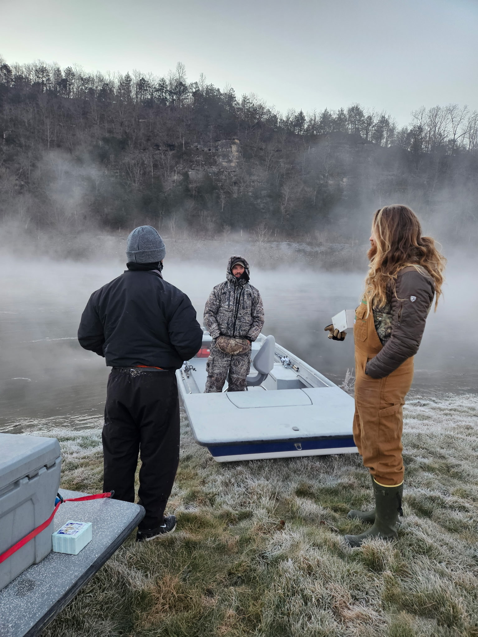 White Hole Resort guide holding a brown trout caught on the fly