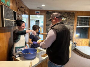 Morgan Serving Country Breakfast on the serving line at the White Hole Resort