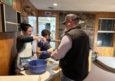 Morgan Serving Country Breakfast on the serving line at the White Hole Resort