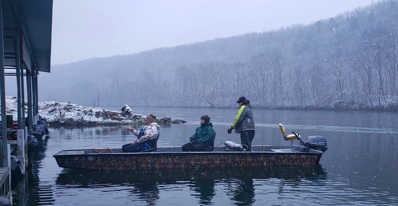 a spin and bait guide returning to the white hole resort dock after a day of guided fishing