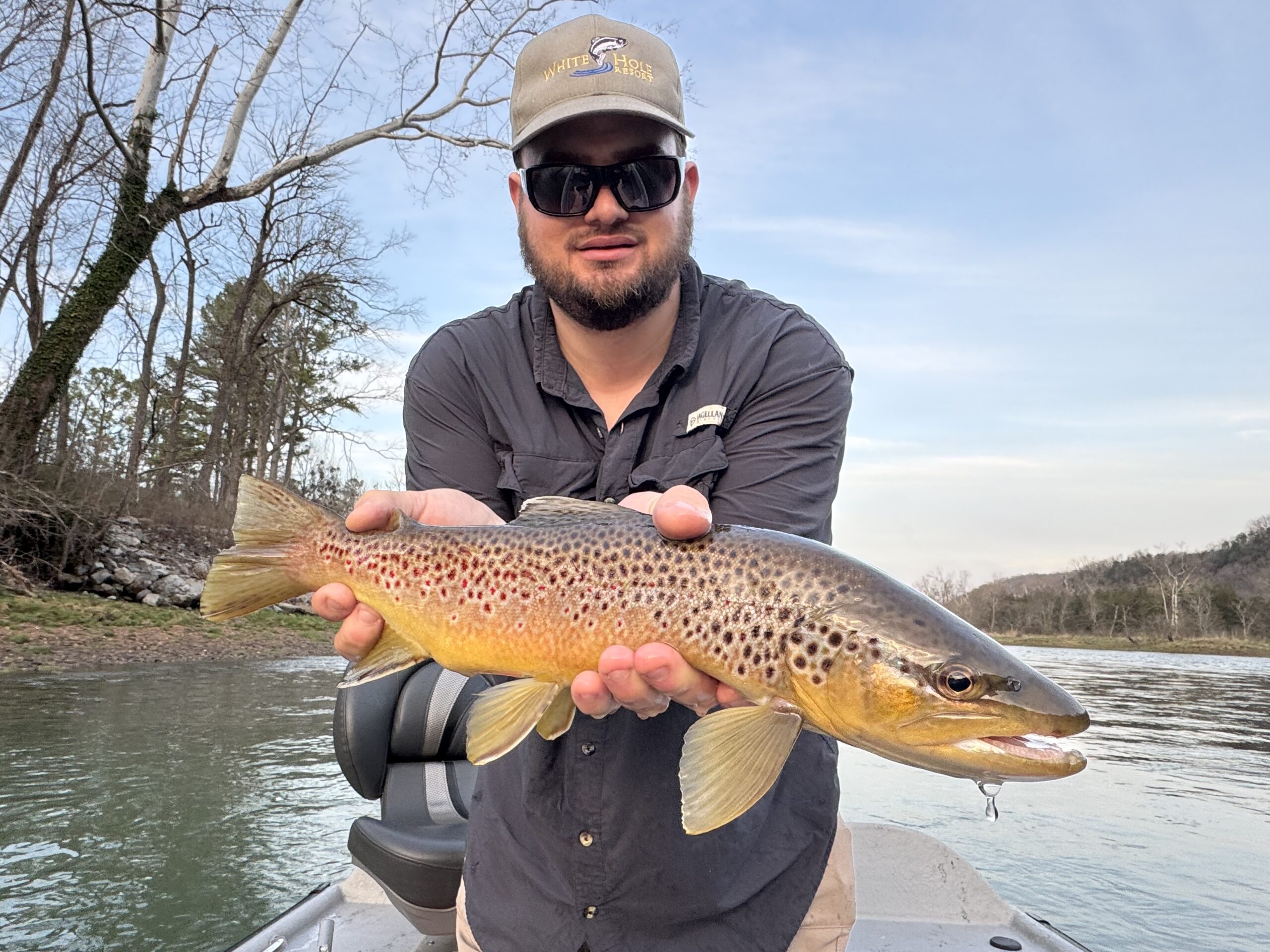 Guide James Kerr with the brown trout he caught on fly on the white river